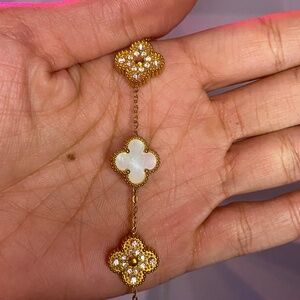 White and gold clover bracelet